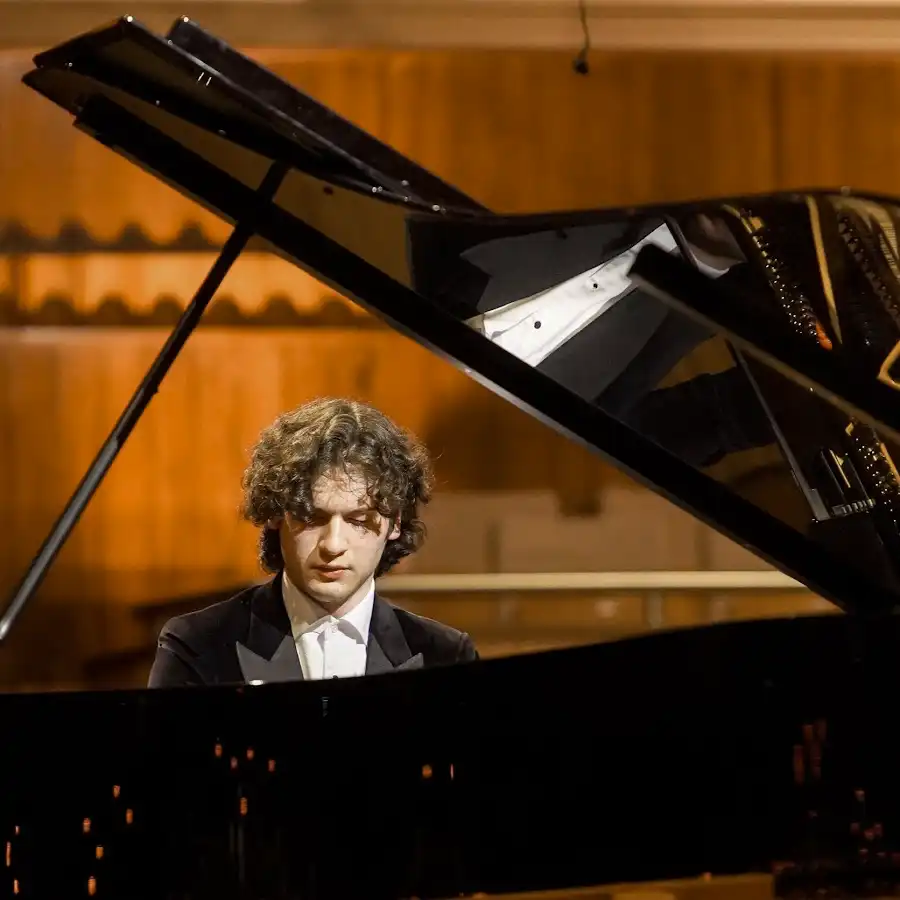 Pianist Aidan Mikdad playing Grand Piano