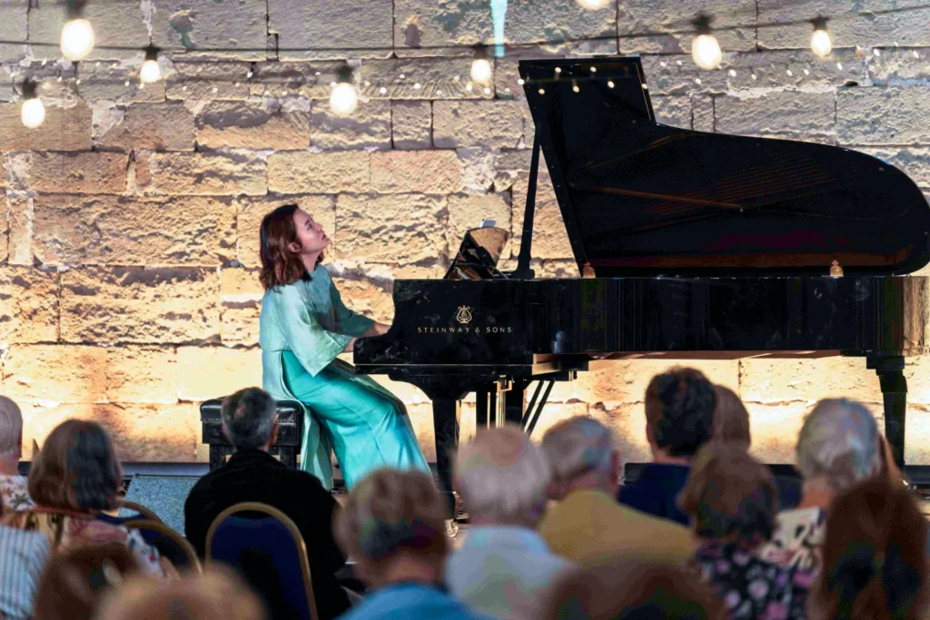 Khanh Nhi Luong on stage performing